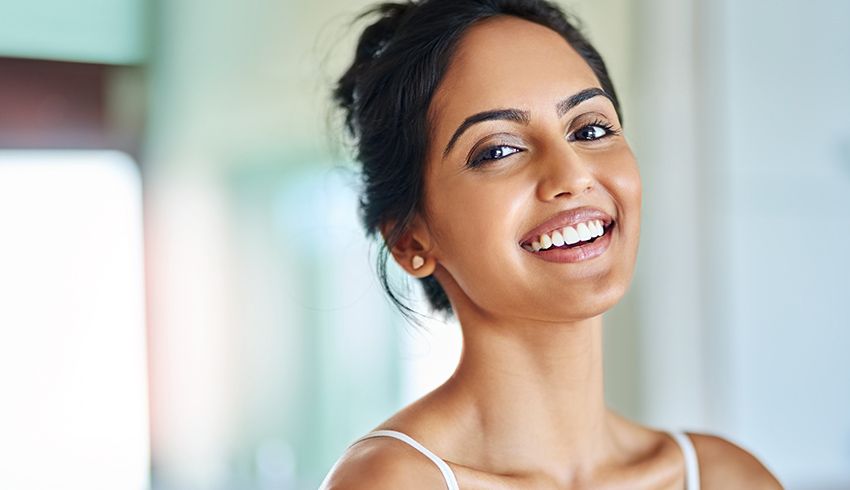 Woman smiling with clear skin